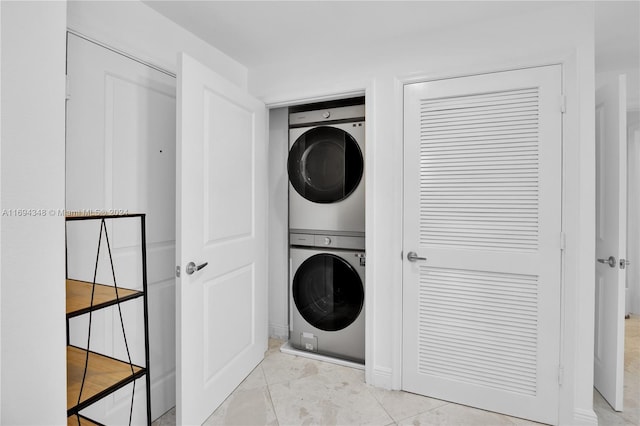 washroom with stacked washer and clothes dryer