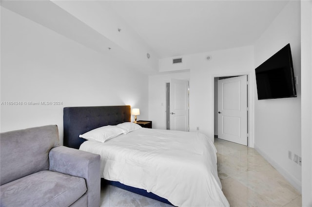 10 Aragon Ave Unit 810, Coral Gables, FL 33134 - bedroom with baseboards and light marble finish floors