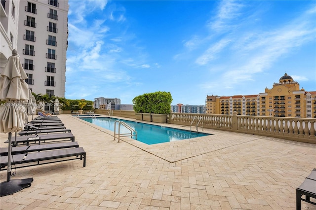 view of swimming pool featuring a patio area