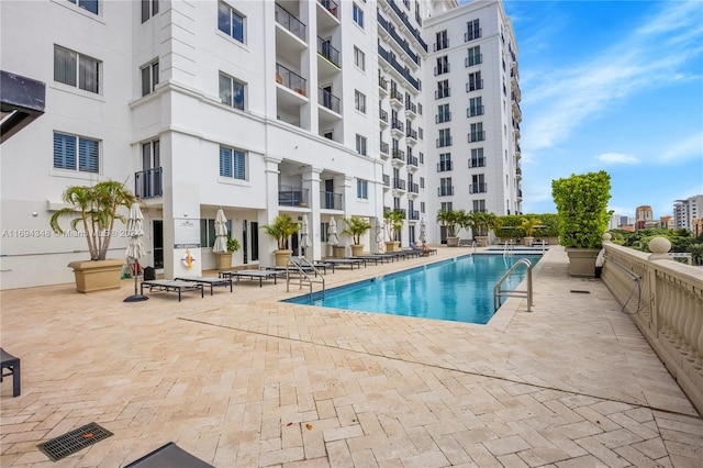 view of swimming pool with a patio