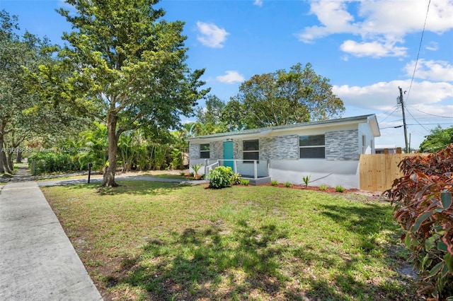 view of front of property with a front lawn