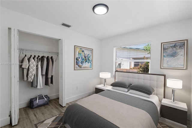 bedroom featuring a closet and hardwood / wood-style floors