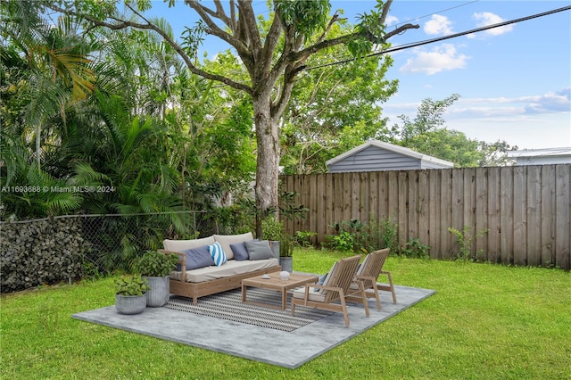 view of yard featuring an outdoor living space and a patio