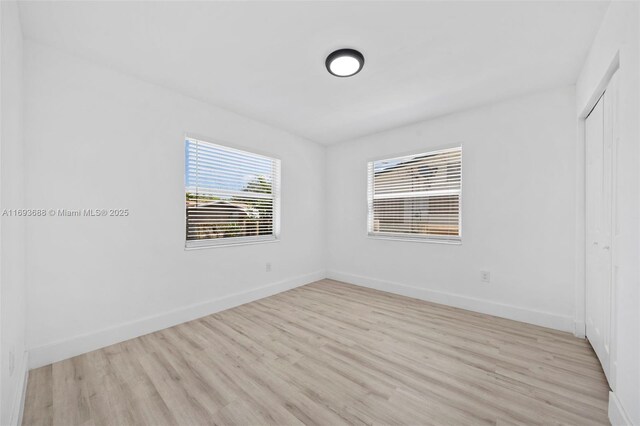 spare room featuring light hardwood / wood-style floors