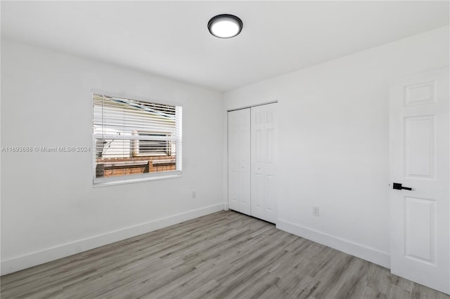 unfurnished room featuring light wood-type flooring