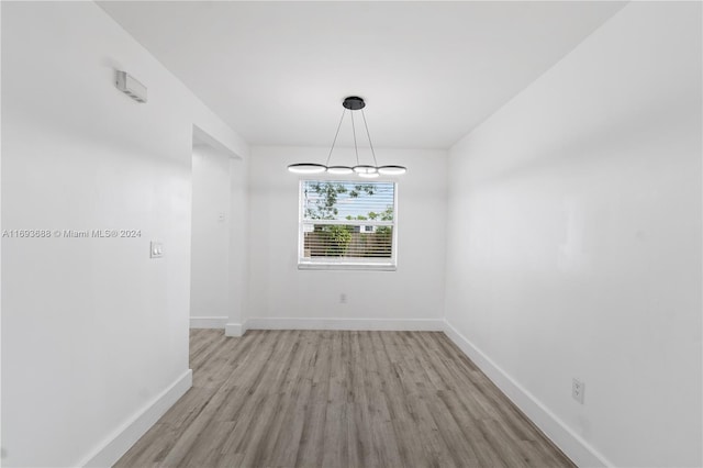 unfurnished dining area with light hardwood / wood-style floors