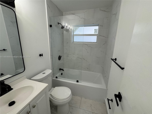 full bathroom featuring toilet, vanity, and tiled shower / bath