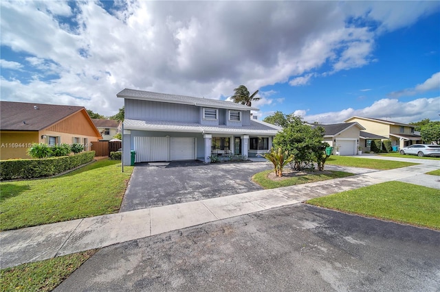 view of front property with a garage and a front yard