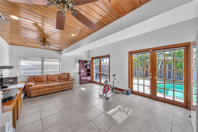 tiled living room with wooden ceiling, a wealth of natural light, and french doors