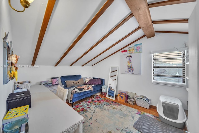 interior space with hardwood / wood-style floors and lofted ceiling with beams