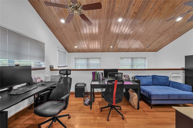 home office with light hardwood / wood-style floors, plenty of natural light, and lofted ceiling