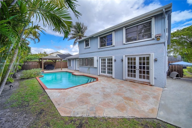 view of pool with a gazebo, french doors, and a patio