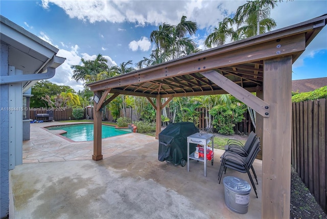 view of swimming pool with a gazebo, a grill, and a patio area