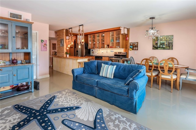 living room featuring a notable chandelier