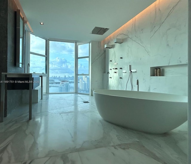 bathroom featuring plus walk in shower and expansive windows