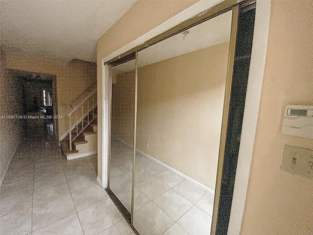 hallway featuring tile patterned floors