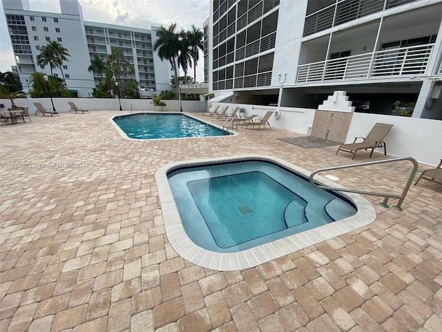 view of swimming pool with a patio area