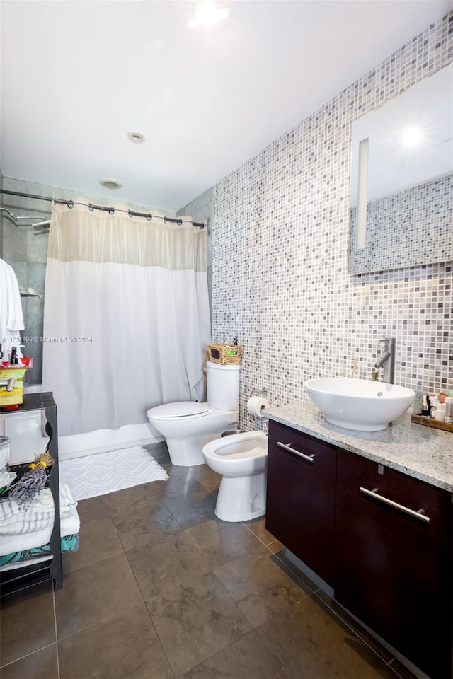 bathroom featuring a shower with curtain, toilet, tile walls, and vanity