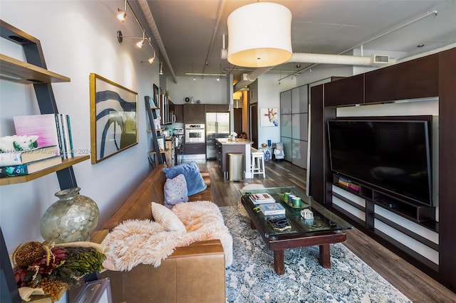 living room with dark hardwood / wood-style floors