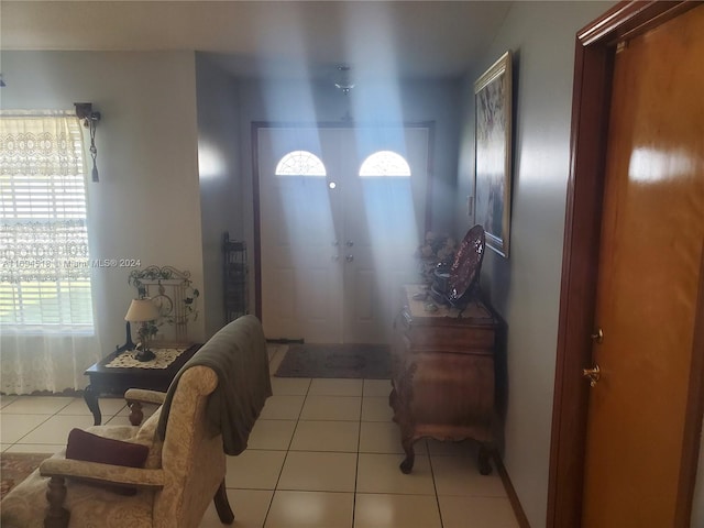 tiled entryway featuring french doors