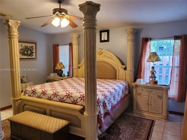 bedroom featuring multiple windows, ceiling fan, and light tile patterned floors