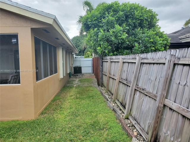 view of yard featuring central air condition unit