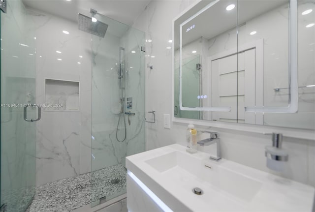 bathroom with vanity and an enclosed shower