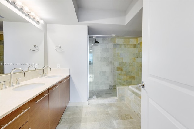 bathroom featuring plus walk in shower and vanity