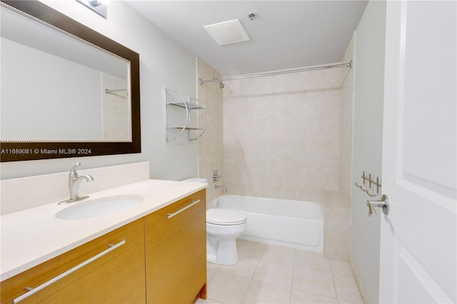 full bathroom featuring tile patterned floors, vanity, toilet, and tiled shower / bath combo