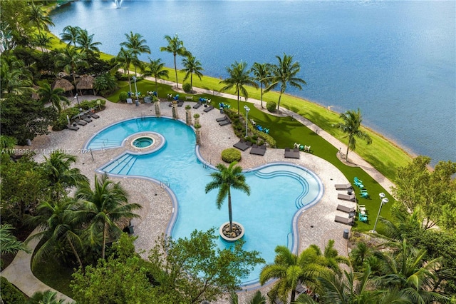 view of pool with a water view