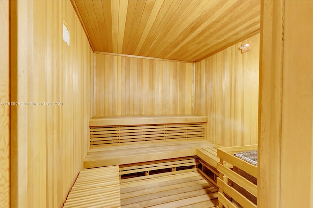 view of sauna / steam room with wooden walls and wood ceiling