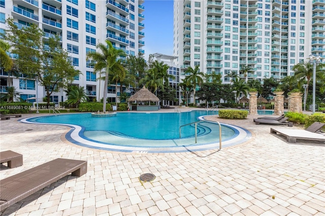 view of swimming pool with a gazebo and a patio