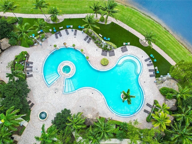 view of swimming pool featuring a water view