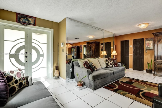 living room with french doors, light tile patterned floors, a healthy amount of sunlight, and a textured ceiling