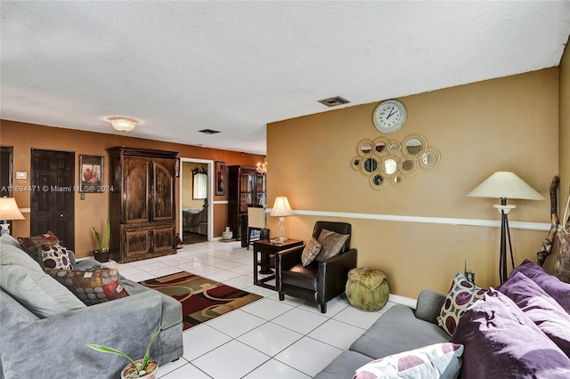 living room featuring light tile patterned floors and a textured ceiling