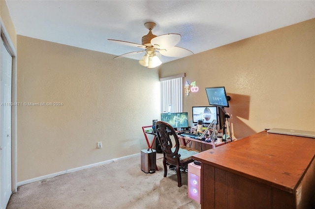 carpeted home office with ceiling fan