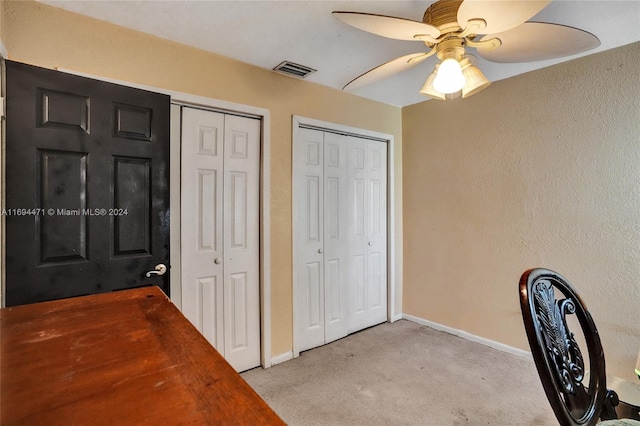 interior space featuring ceiling fan