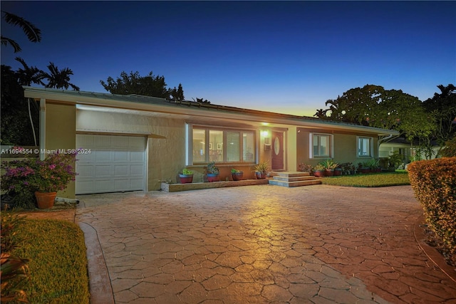 single story home with a garage