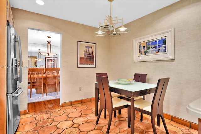 dining space featuring light wood-type flooring