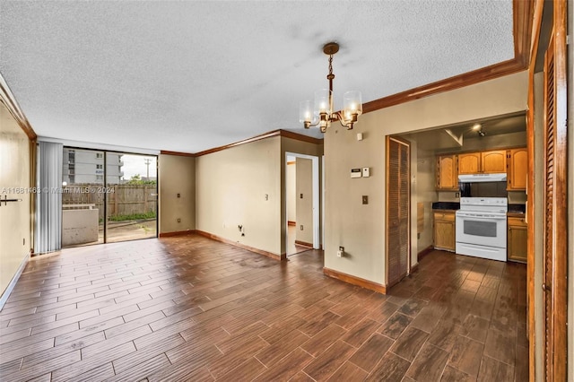 interior space featuring dark hardwood / wood-style floors, ornamental molding, a textured ceiling, and an inviting chandelier