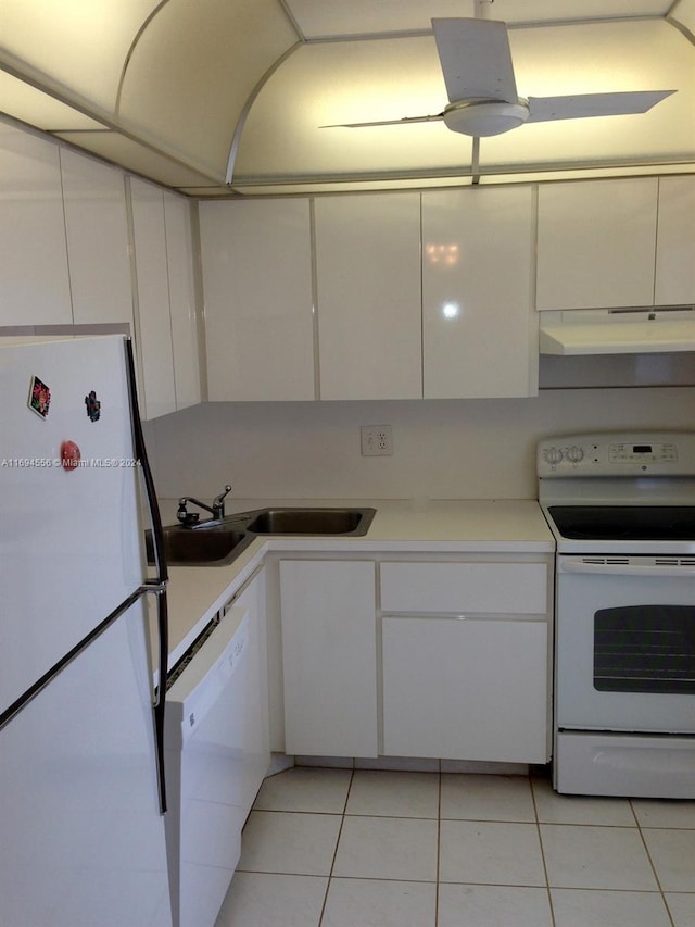 kitchen featuring sink, white cabinets, white appliances, and light tile patterned floors