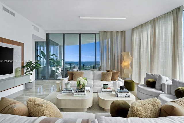 living room featuring floor to ceiling windows