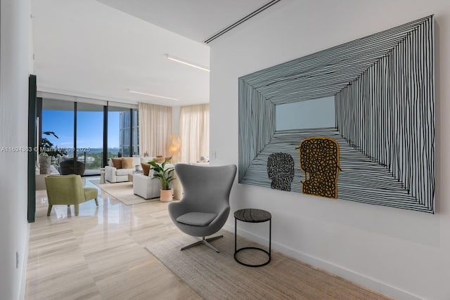 sitting room featuring a wall of windows