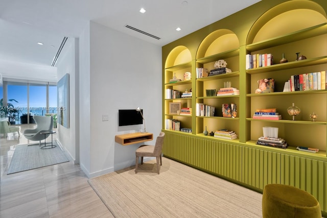 sitting room with built in shelves