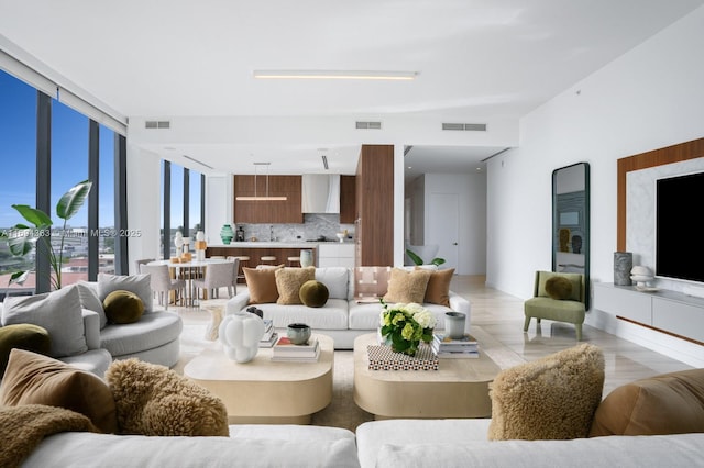 living room with floor to ceiling windows