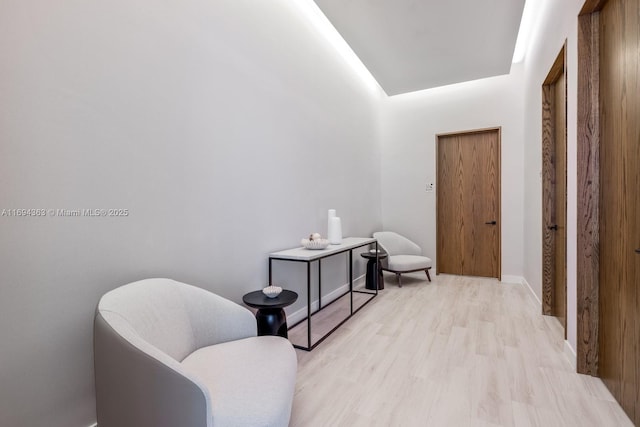 sitting room with light wood-type flooring