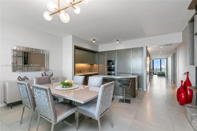 18975 Collins Ave Unit 3402, Sunny Isles Beach, FL 33160 - dining room featuring a chandelier and light tile patterned flooring