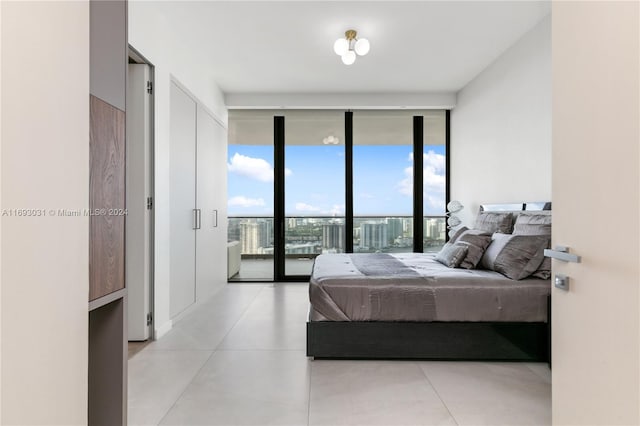 bedroom with access to exterior and expansive windows