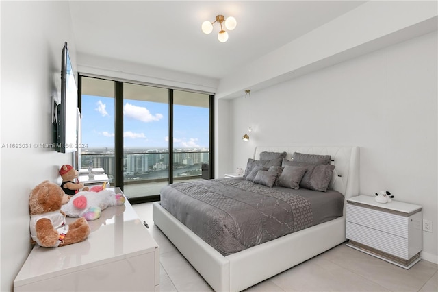 18975 Collins Ave Unit 3402, Sunny Isles Beach, FL 33160 - bedroom with access to exterior, expansive windows, and light tile patterned floors