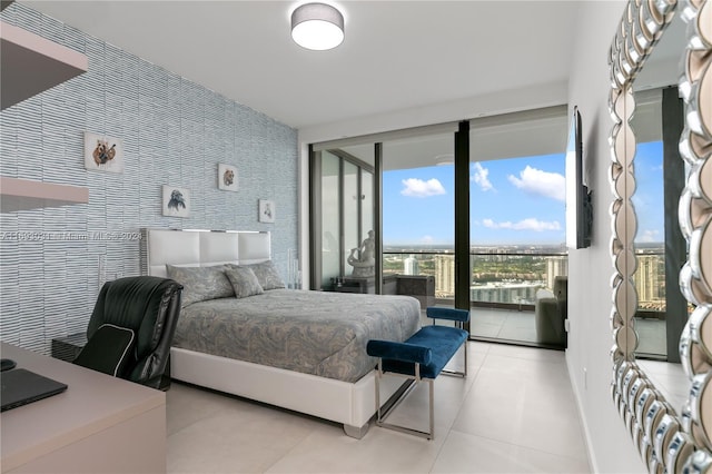 18975 Collins Ave Unit 3402, Sunny Isles Beach, FL 33160 - bedroom featuring access to outside, tile patterned flooring, wallpapered walls, and a desk